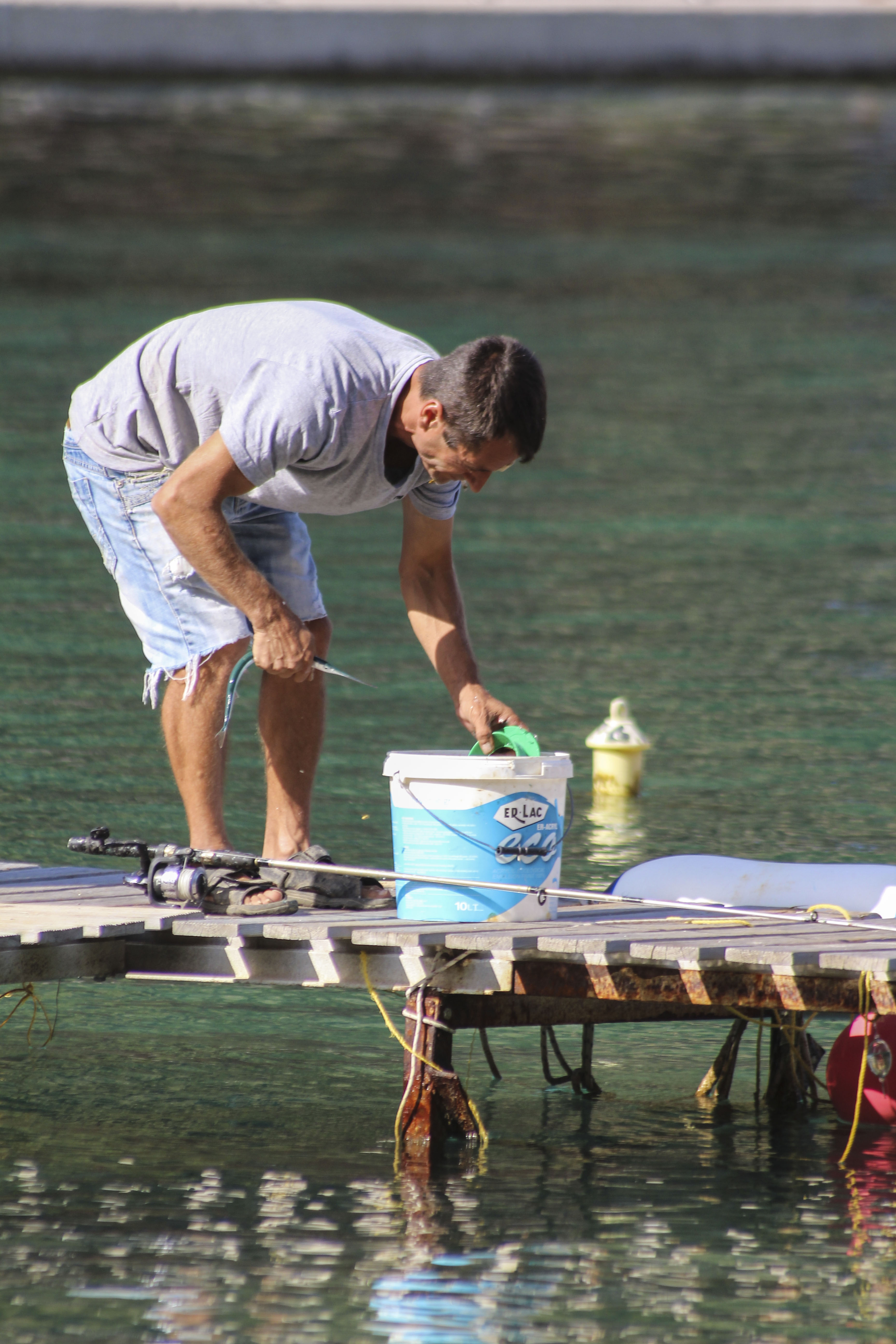 A man fishing in Frikes, Ithaca, Greece